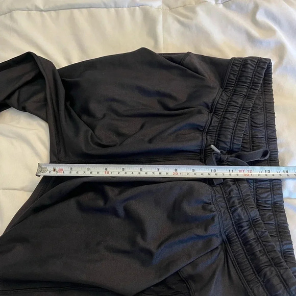 Lululemon black joggers with drawstring elastic waist band, and hemline. Size 4 - Picture 12 of 13